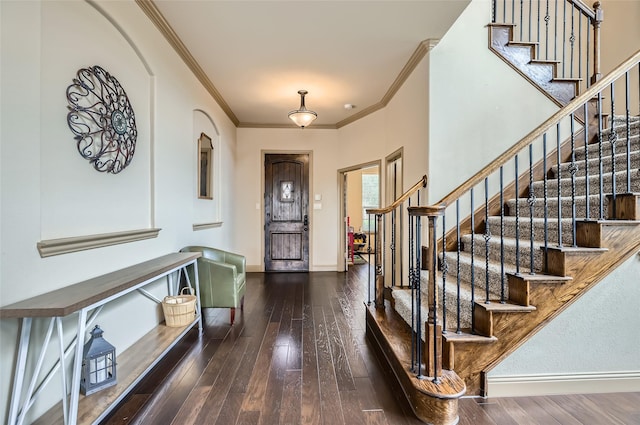 entrance foyer with baseboards, stairs, crown molding, and hardwood / wood-style flooring