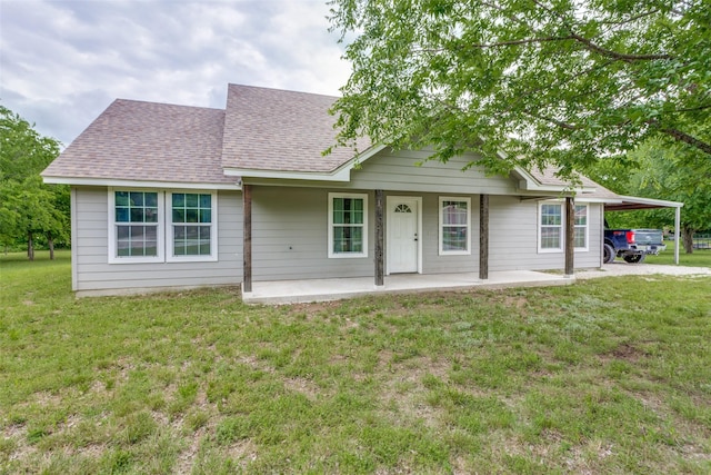 140 Tnt Ct, Springtown, TX 76082 - view of front facade with a carport, a shingled roof, and a front lawn