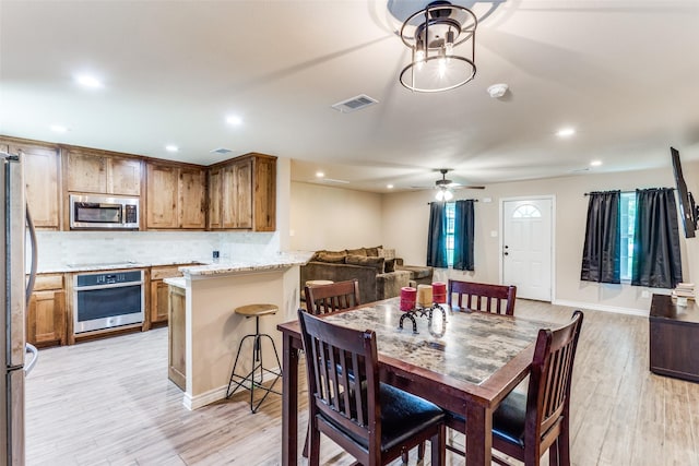 140 Tnt Ct, Springtown, TX 76082 - dining space with a ceiling fan, visible vents, recessed lighting, and light wood finished floors