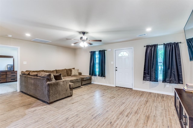 140 Tnt Ct, Springtown, TX 76082 - living room featuring visible vents, light wood-style flooring, ceiling fan, and baseboards
