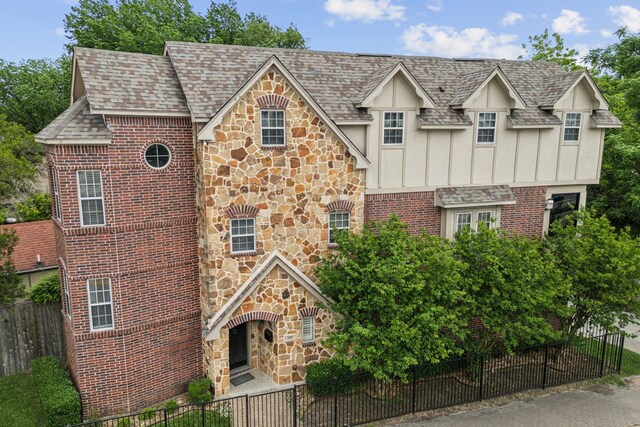 5102 Ridgedale Ave, Dallas, TX 75206 - english style home with stone siding, board and batten siding, and roof with shingles