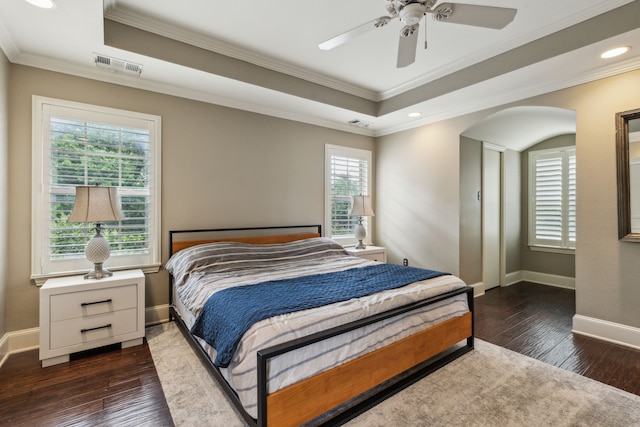 5102 Ridgedale Ave, Dallas, TX 75206 - bedroom featuring multiple windows, a raised ceiling, dark wood-style floors, crown molding, and recessed lighting
