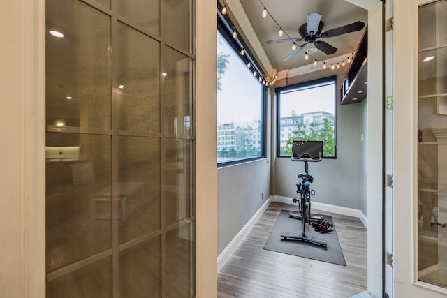 5102 Ridgedale Ave, Dallas, TX 75206 - exercise area featuring light wood-style flooring, baseboards, and a ceiling fan