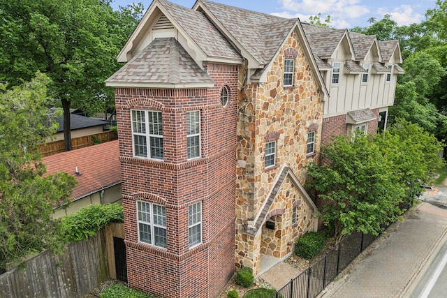 5102 Ridgedale Ave, Dallas, TX 75206 - view of front facade featuring brick siding, stone siding, and roof with shingles