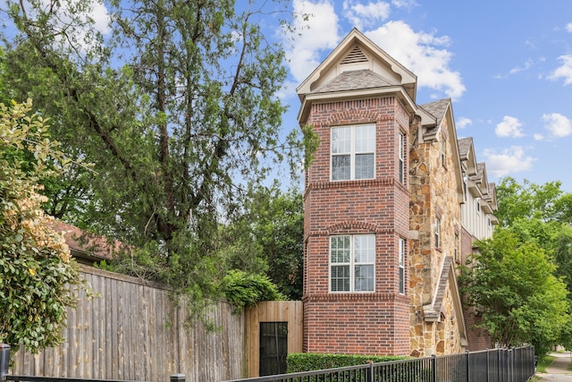 5102 Ridgedale Ave, Dallas, TX 75206 - view of side of home featuring brick siding and stone siding