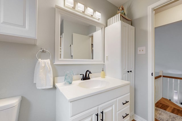 bathroom with vanity and toilet