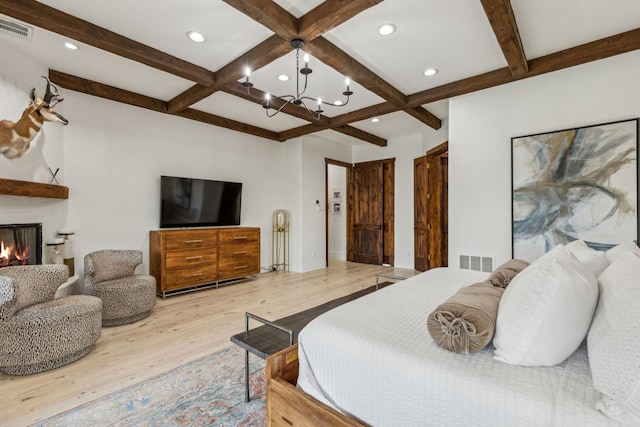 2291 W Fm 550, Rockwall, TX 75032 - bedroom with visible vents, light wood-style flooring, coffered ceiling, and a notable chandelier