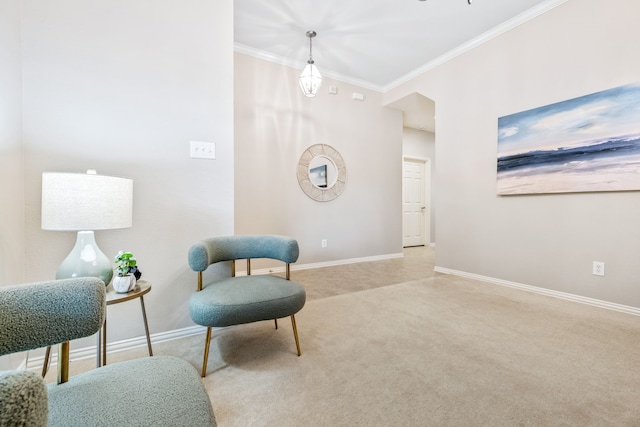 living area with carpet flooring, baseboards, and ornamental molding