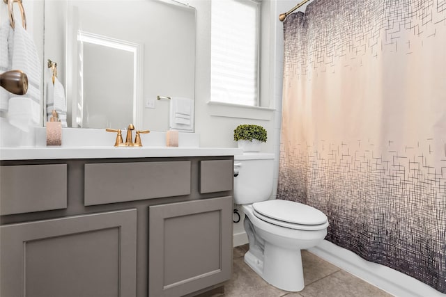 full bathroom with vanity, tile patterned flooring, and toilet