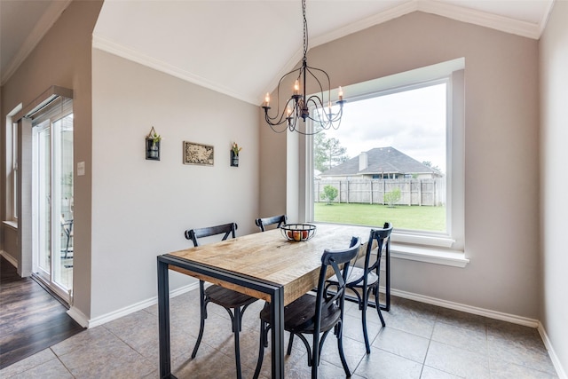dining area featuring baseboards, ornamental molding, tile patterned flooring, and lofted ceiling