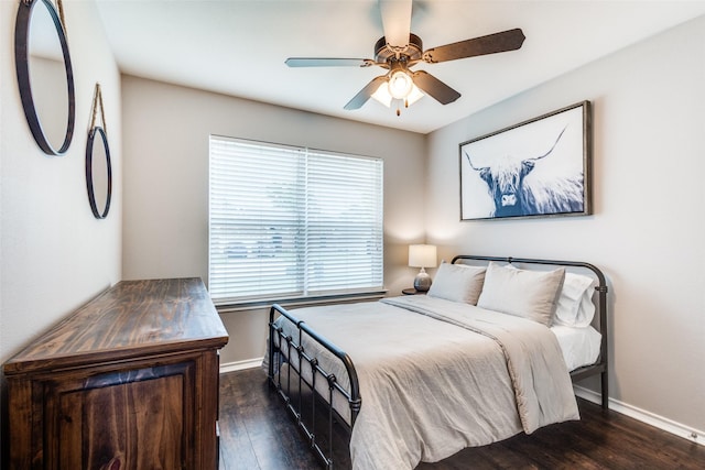 bedroom with baseboards, ceiling fan, and wood finished floors