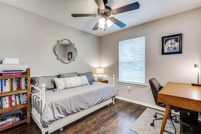 bedroom featuring baseboards, ceiling fan, and wood finished floors