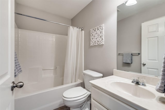 full bathroom featuring vanity, shower / bath combo, and toilet