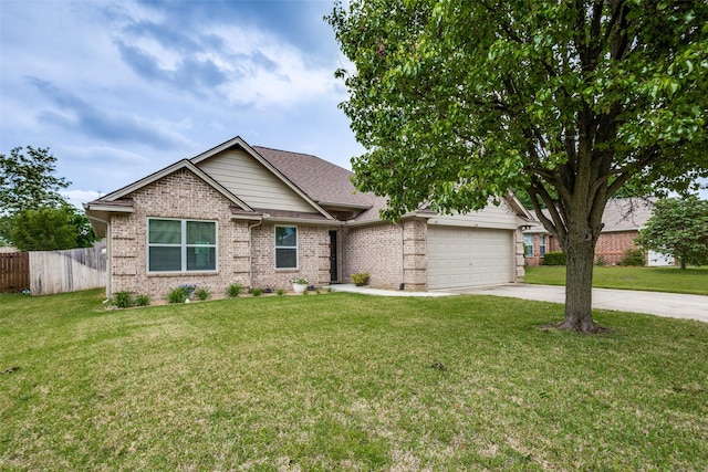 craftsman-style house featuring fence, a front yard, brick siding, an attached garage, and driveway