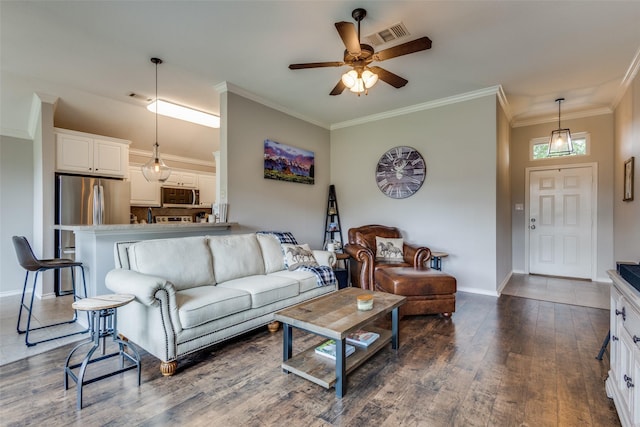 living area with ceiling fan, visible vents, crown molding, baseboards, and dark wood-style floors