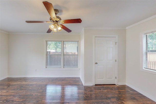 unfurnished room with crown molding, a ceiling fan, baseboards, and wood finished floors