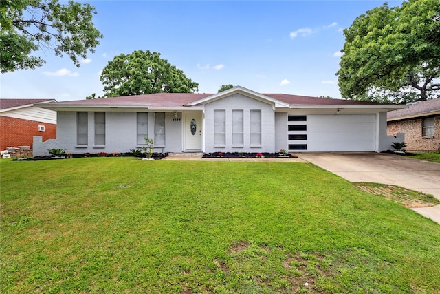 ranch-style home featuring a garage, a front yard, driveway, and brick siding