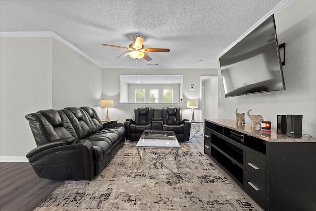 living area with crown molding, ceiling fan, a textured ceiling, wood finished floors, and visible vents