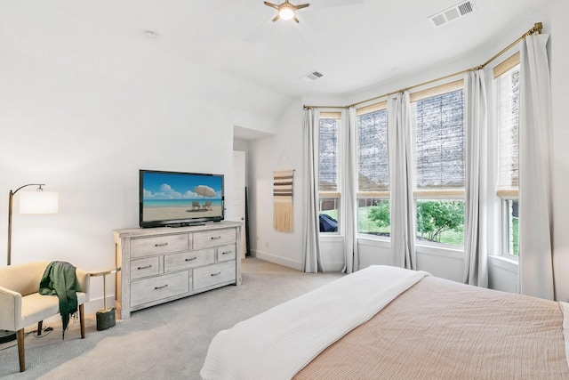 bedroom featuring visible vents, baseboards, ceiling fan, and light colored carpet