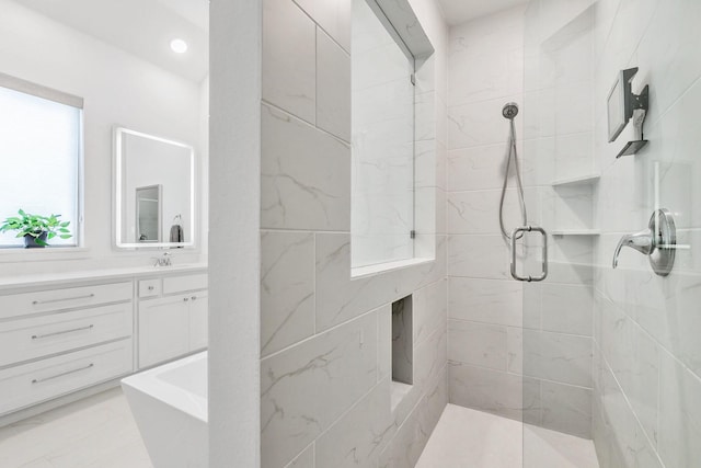 bathroom with vanity, a stall shower, and marble finish floor