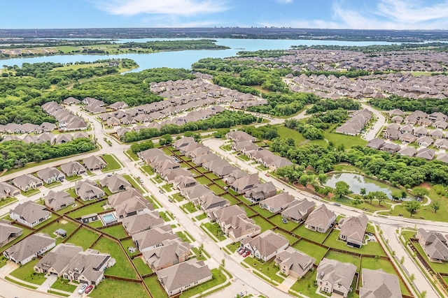 bird's eye view featuring a residential view and a water view