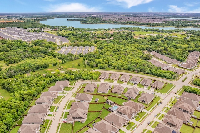 drone / aerial view with a residential view and a water view