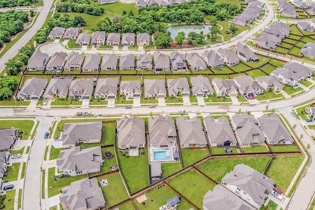 birds eye view of property with a residential view