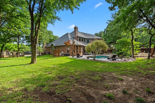 view of yard with a patio and an outdoor pool