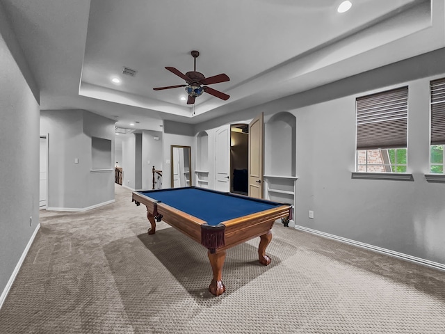 game room featuring baseboards, ceiling fan, carpet, and a tray ceiling