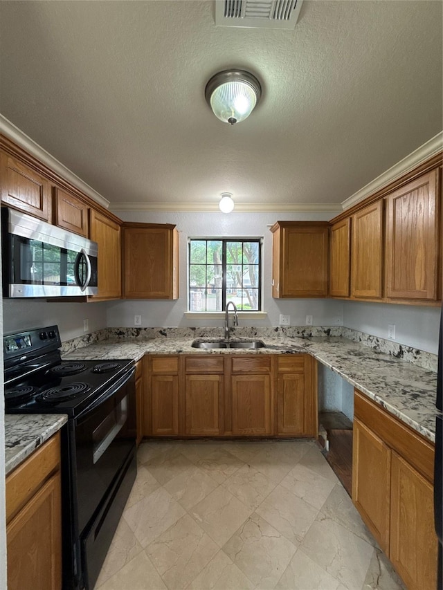 kitchen featuring crown molding, a sink, black range with electric cooktop, and stainless steel microwave