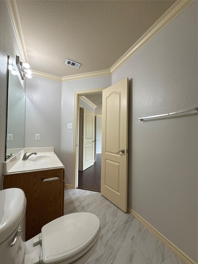half bath with visible vents, ornamental molding, marble finish floor, vanity, and toilet