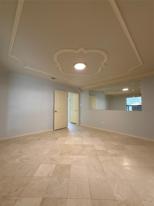 unfurnished room with baseboards