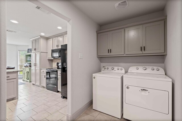 washroom featuring light tile patterned floors, recessed lighting, independent washer and dryer, and visible vents