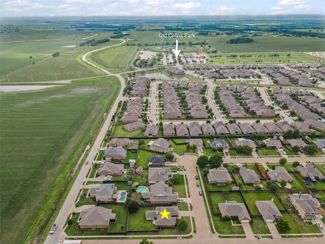 birds eye view of property with a residential view
