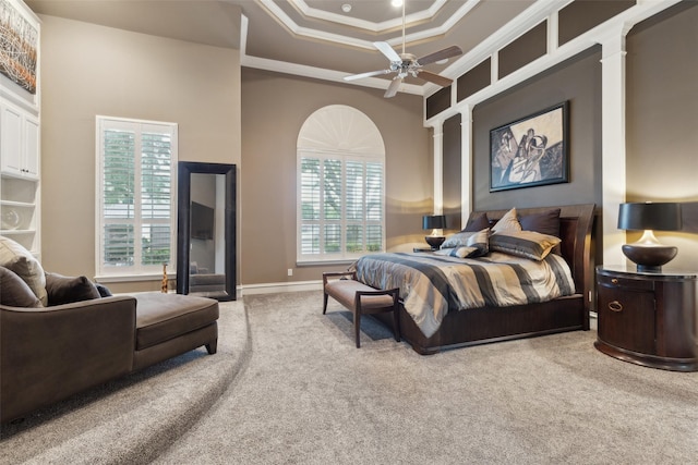 bedroom featuring crown molding, carpet flooring, and baseboards