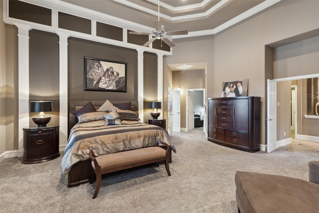 bedroom featuring carpet floors, decorative columns, and ornamental molding