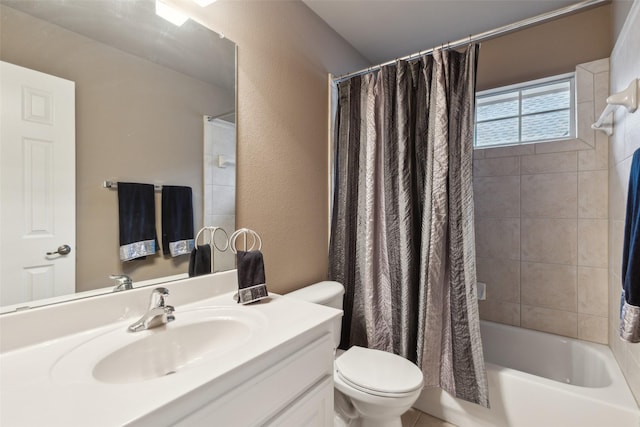 full bathroom featuring toilet, a textured wall, shower / tub combo, and vanity