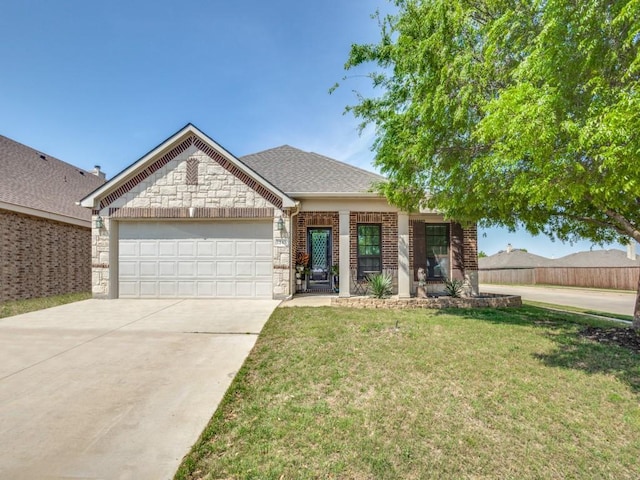 ranch-style home featuring a garage, a front yard, stone siding, brick siding, and concrete driveway