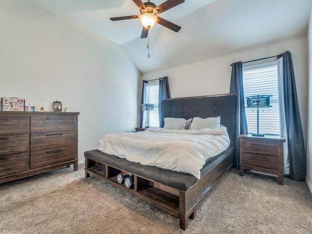 bedroom with light colored carpet, a ceiling fan, and lofted ceiling