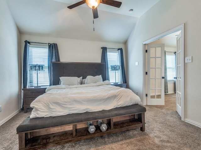bedroom with ceiling fan, french doors, vaulted ceiling, baseboards, and carpet