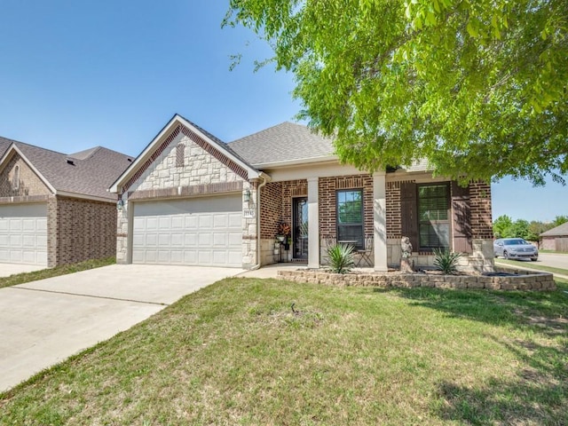 view of front of property featuring driveway, brick siding, a front lawn, an attached garage, and stone siding