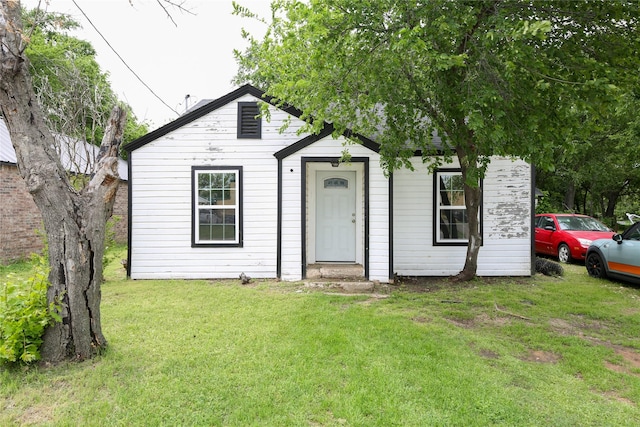 bungalow with a front lawn