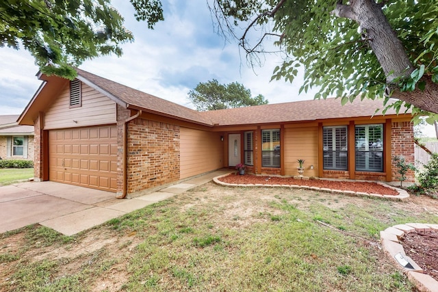 ranch-style house with concrete driveway, brick siding, a front lawn, and a garage