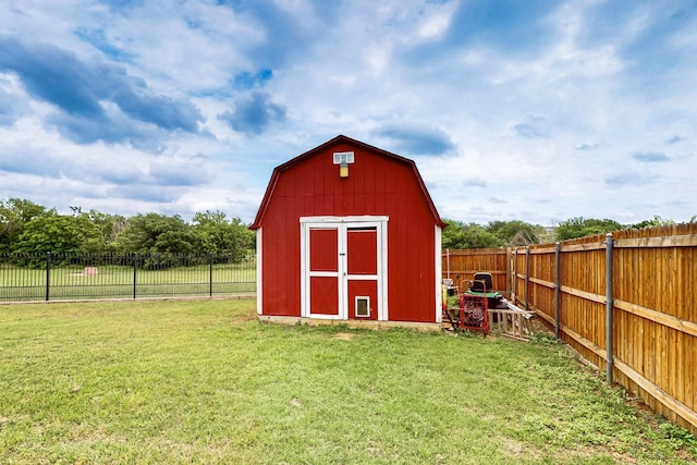view of shed featuring a fenced backyard