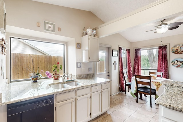 kitchen featuring ceiling fan, a sink, white cabinets, lofted ceiling, and black dishwasher