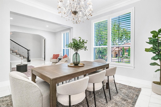3401 Anthony Cir, Rowlett, TX 75088 - dining area featuring crown molding, arched walkways, stairway, plenty of natural light, and a chandelier