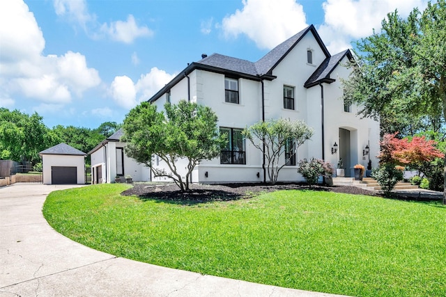 3401 Anthony Cir, Rowlett, TX 75088 - french country home featuring stucco siding, a front yard, driveway, and a garage