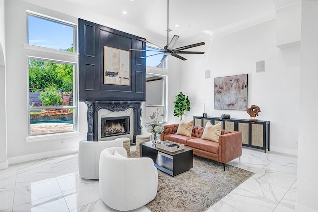 3401 Anthony Cir, Rowlett, TX 75088 - living room with light marble finish floors, baseboards, a ceiling fan, a fireplace, and recessed lighting