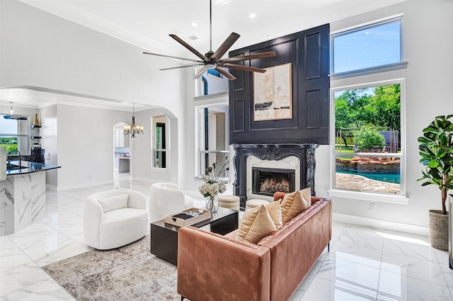 3401 Anthony Cir, Rowlett, TX 75088 - living room with arched walkways, light marble finish floors, a chandelier, a high ceiling, and recessed lighting