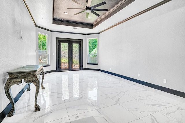 3401 Anthony Cir, Rowlett, TX 75088 - spare room featuring french doors, crown molding, healthy amount of natural light, a raised ceiling, and marble finish flooring